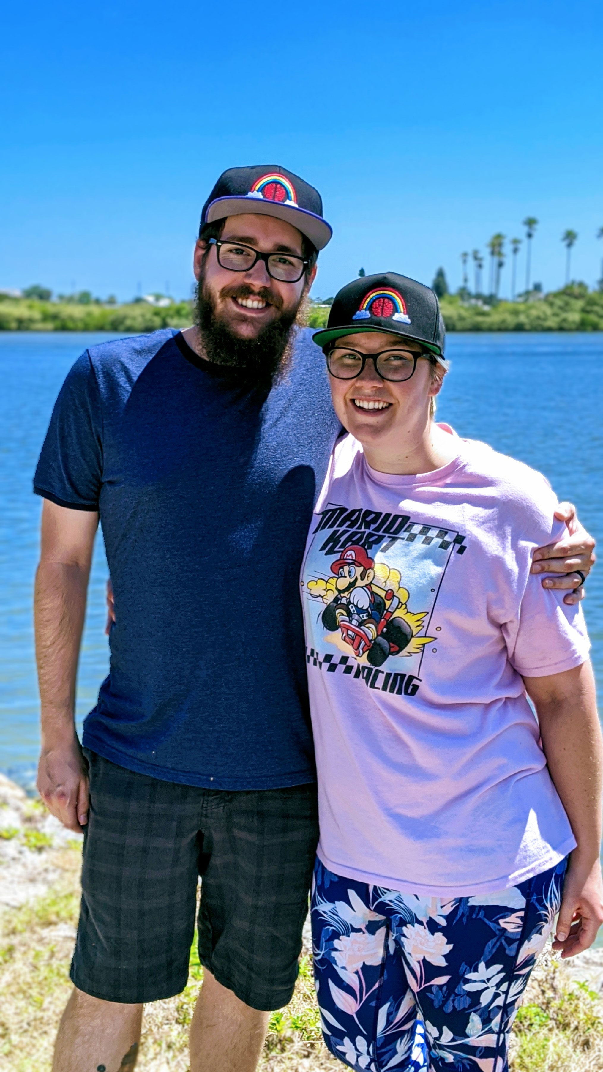 co-founders Michael and Taylor wearing Rainbow Brains embroidered hats