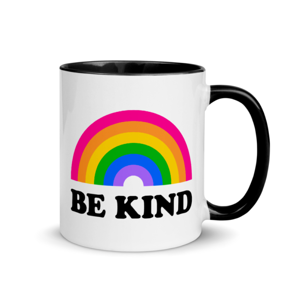 white mug with black inside and rim. the design says be kind with a rainbow above it
